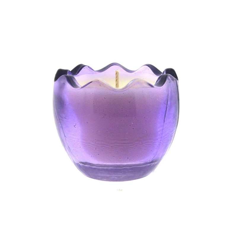A purple glass Easter egg candle on a white background.