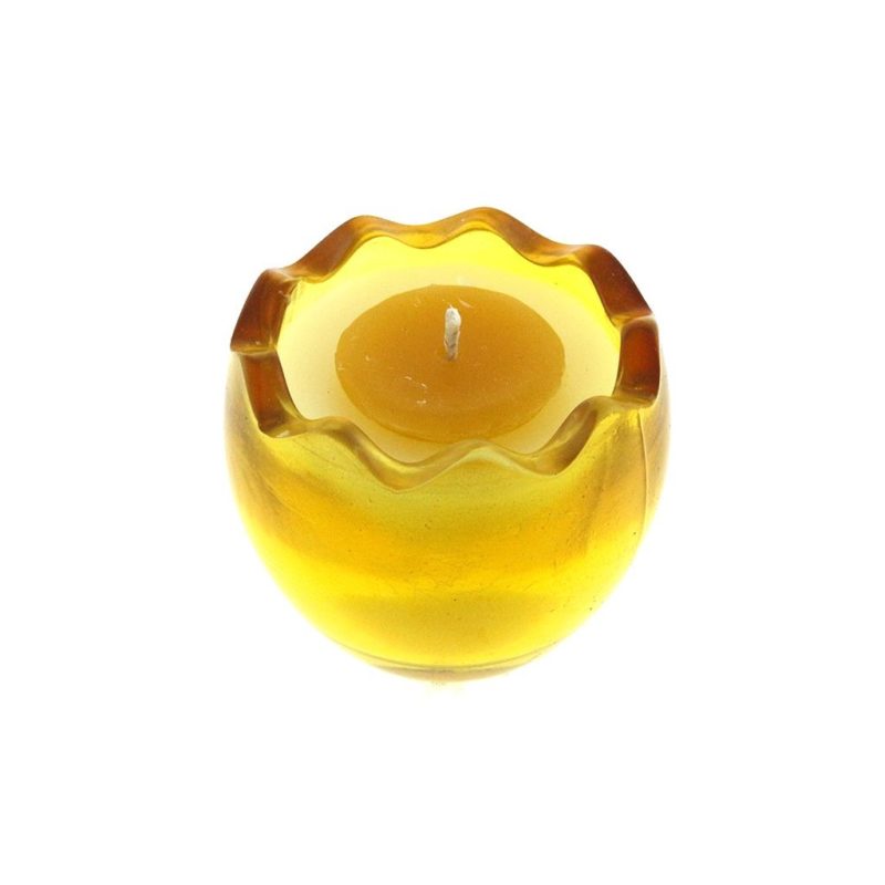 A Yellow Glass Easter Egg candle w/ white and yellow Wax candle holder on a white background.