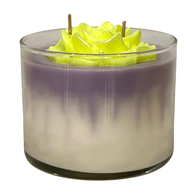 A Green Tie-Dye candle with a Pink Flower - Floral Scented in it, scented with a floral fragrance.