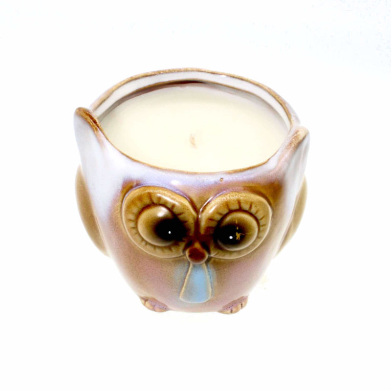 A Light Brown Night Owl Candle on a white background.