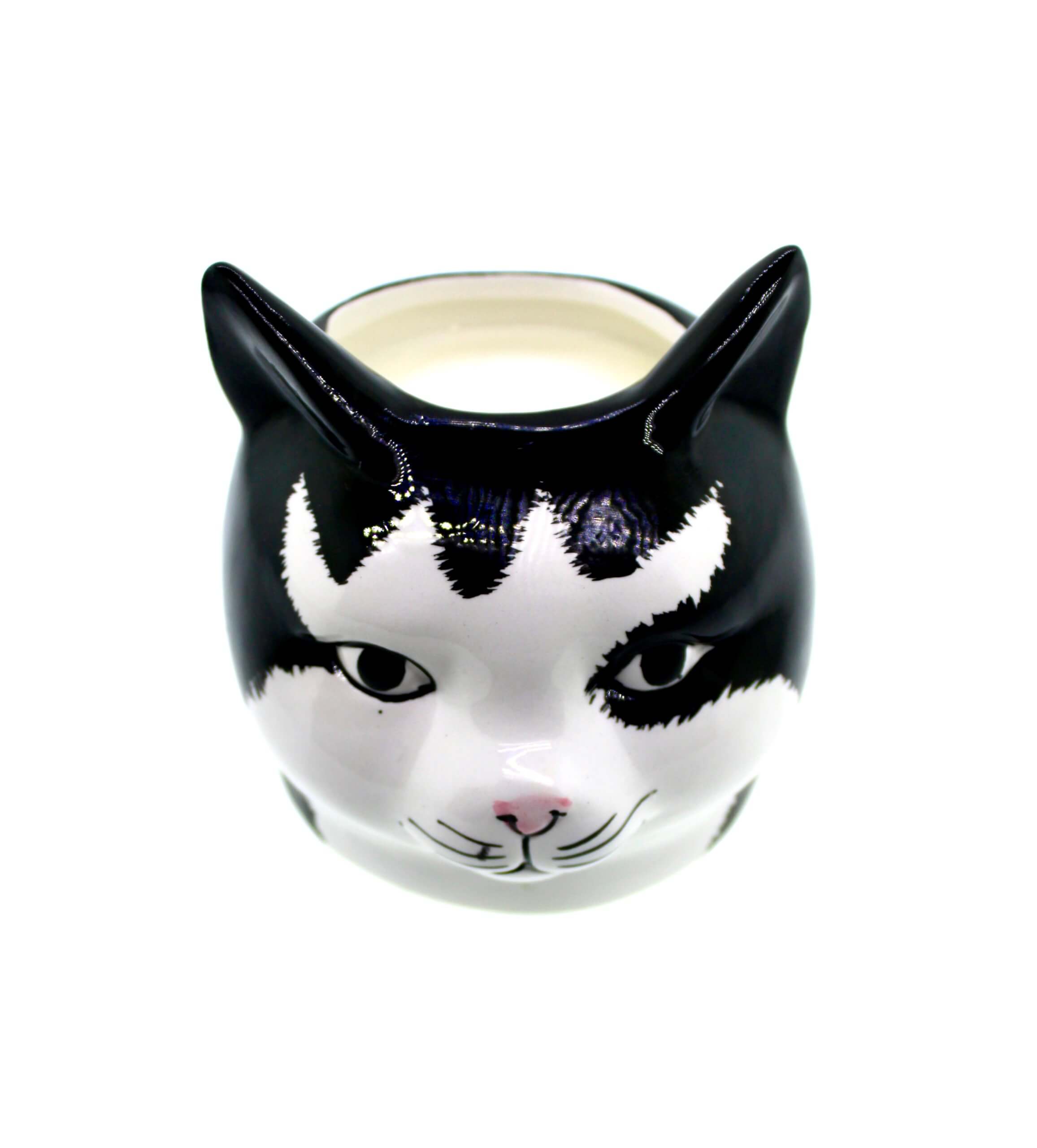 A black and white Cat Face Candle shaped candle holder.