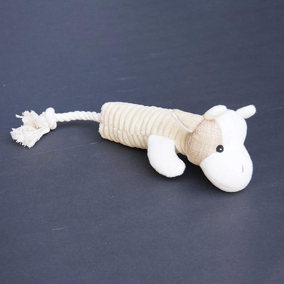 A White Plush Dog Toy With Squeaker with a rope attached to it.