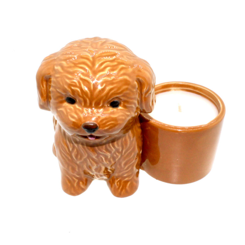 A brown ceramic Puppy Candle holder with a candle inside.