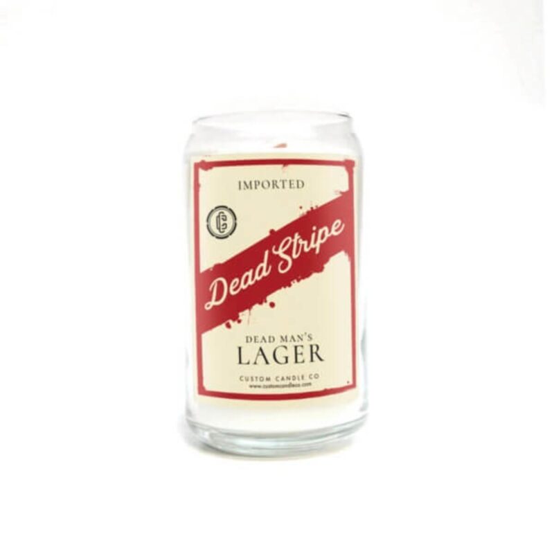 A Dead Strip Dead Man’s Lager Beer Can Candle with the words "dead slope lager" on it.