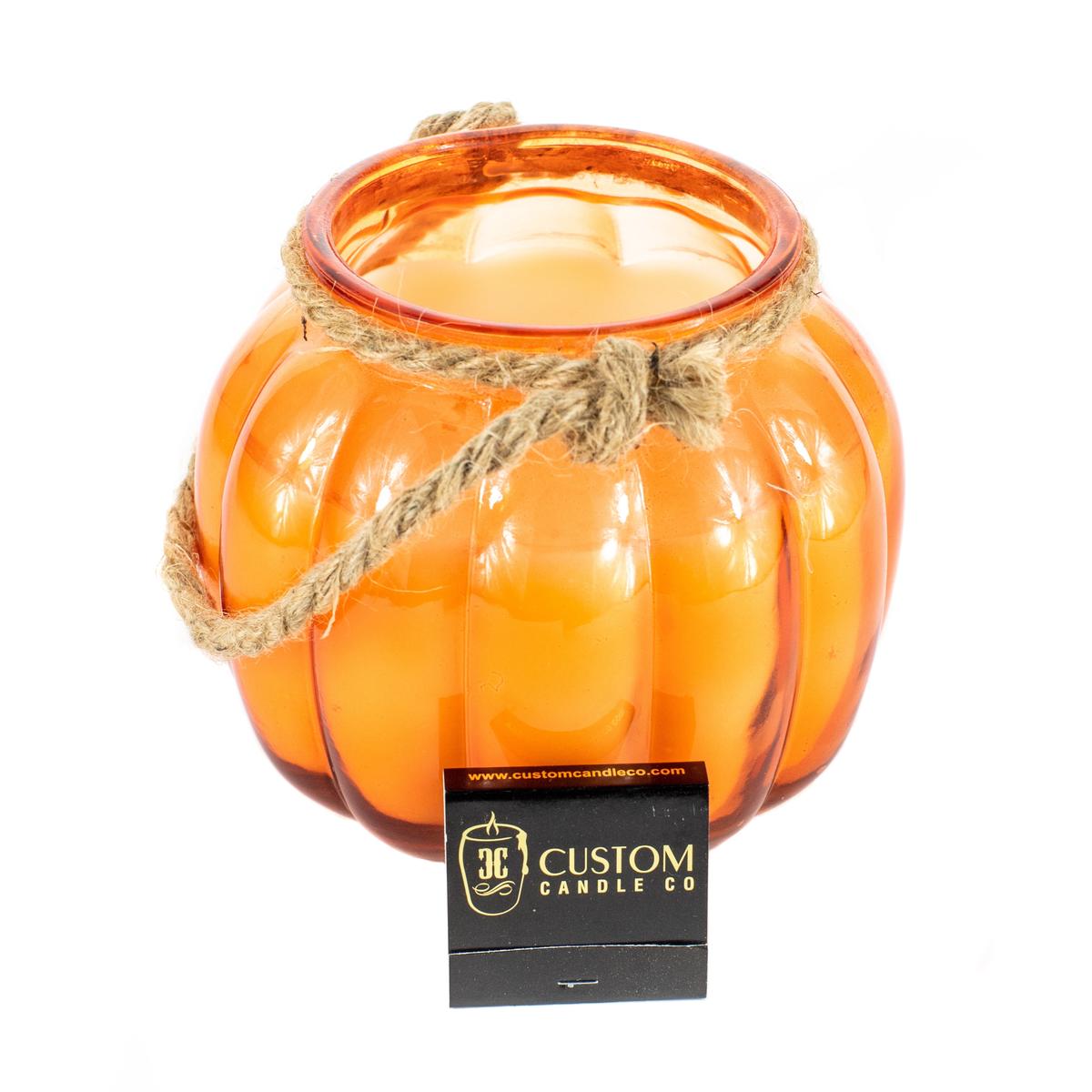 Glass Pumpkin Lantern-shaped candle with a twine handle.