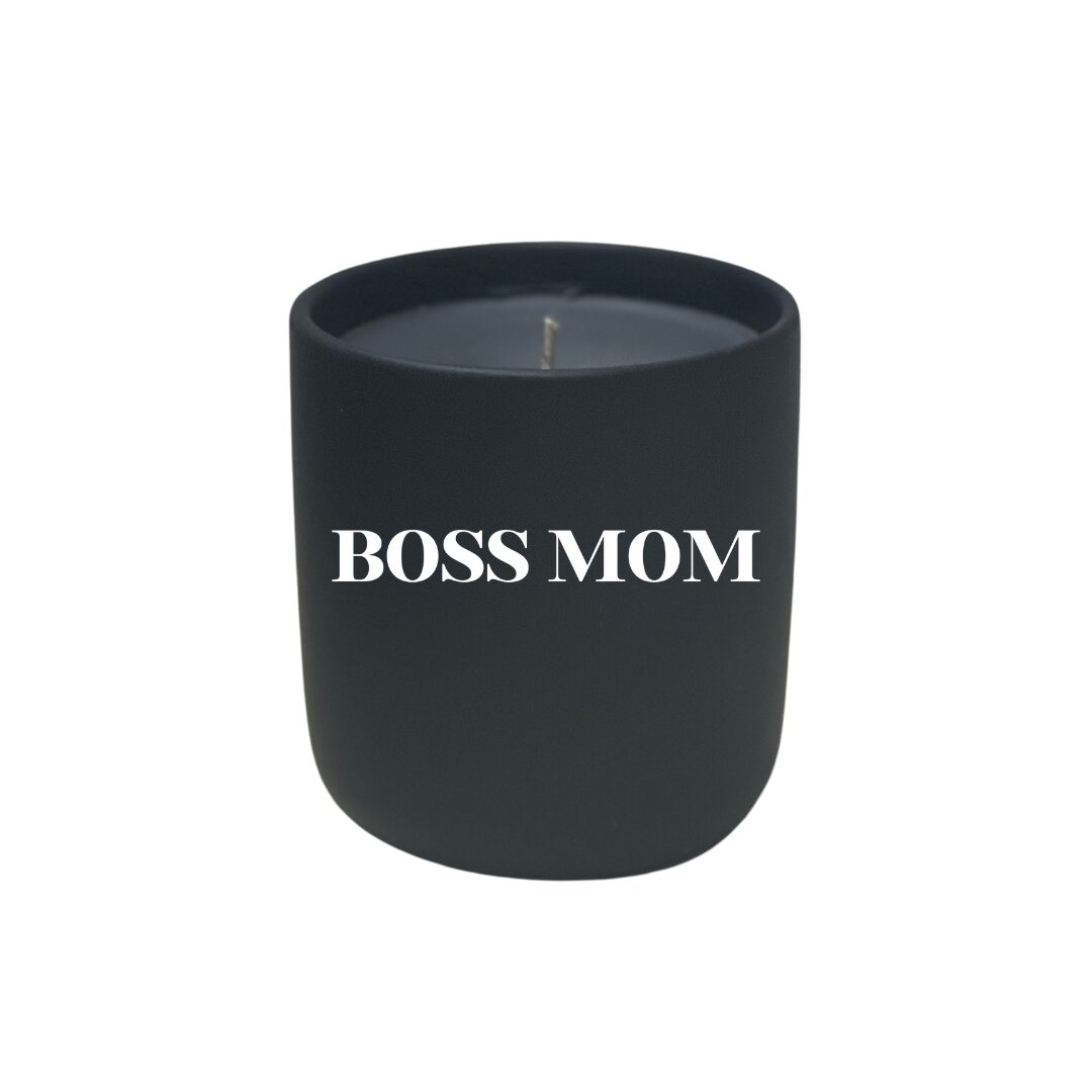 A black Quoted Candle - Divorce Party (Copy) with the quote "boss mom" written on it, perfect for a divorce party celebration.