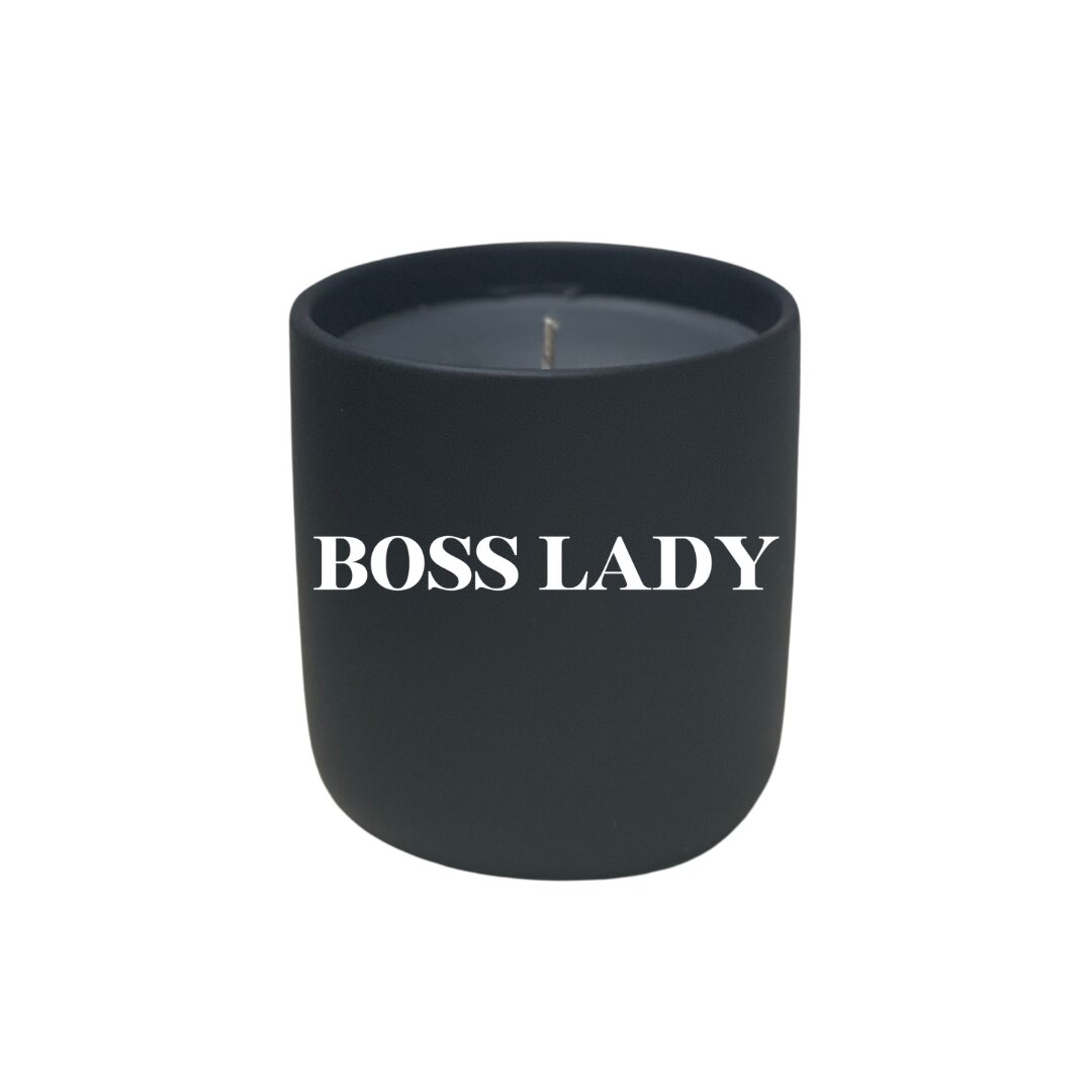 A black Quoted Candle - Boss Mom with the words "boss lady" on it.